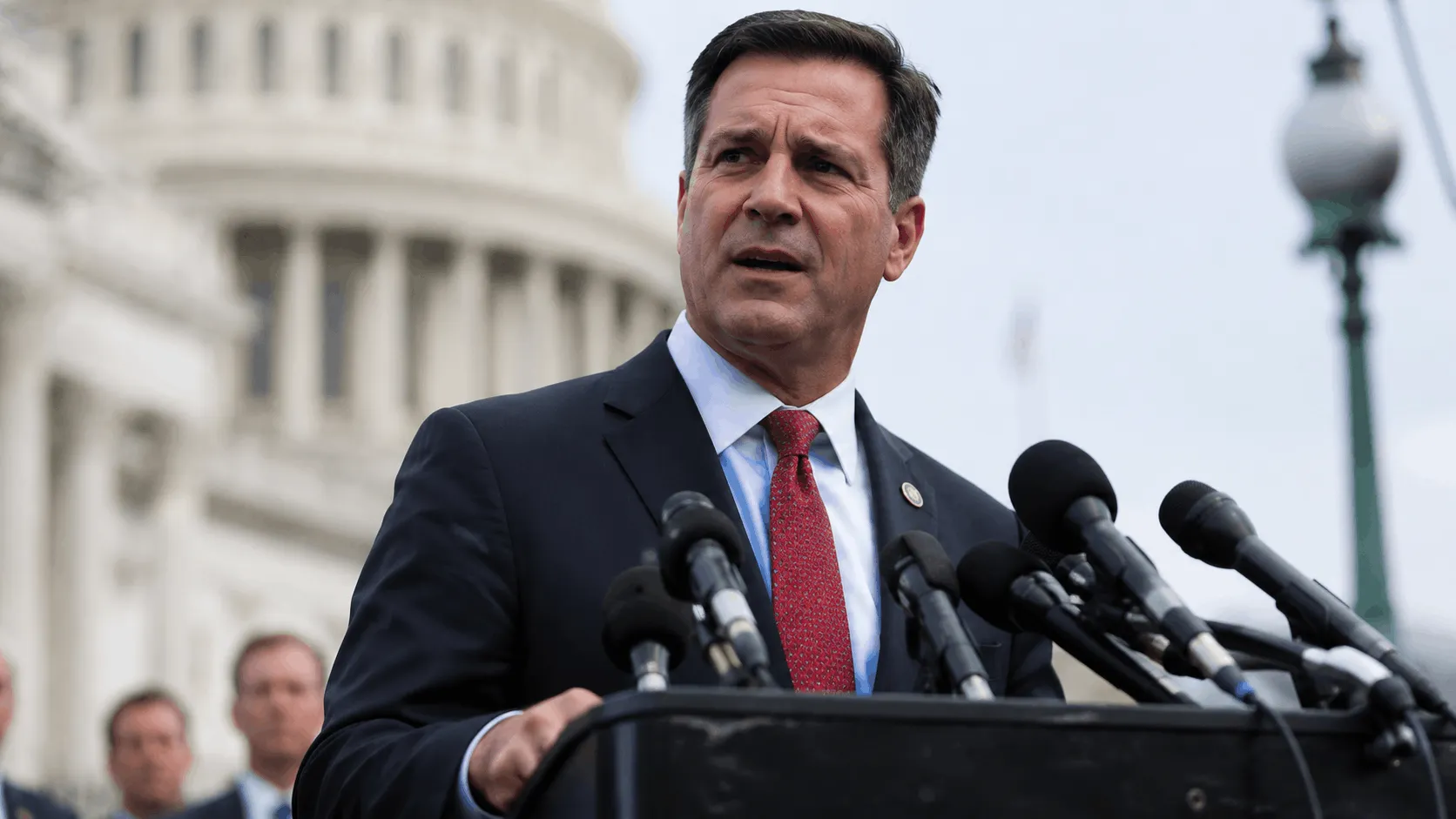 Johnson speaking at a Capitol Hill press conference